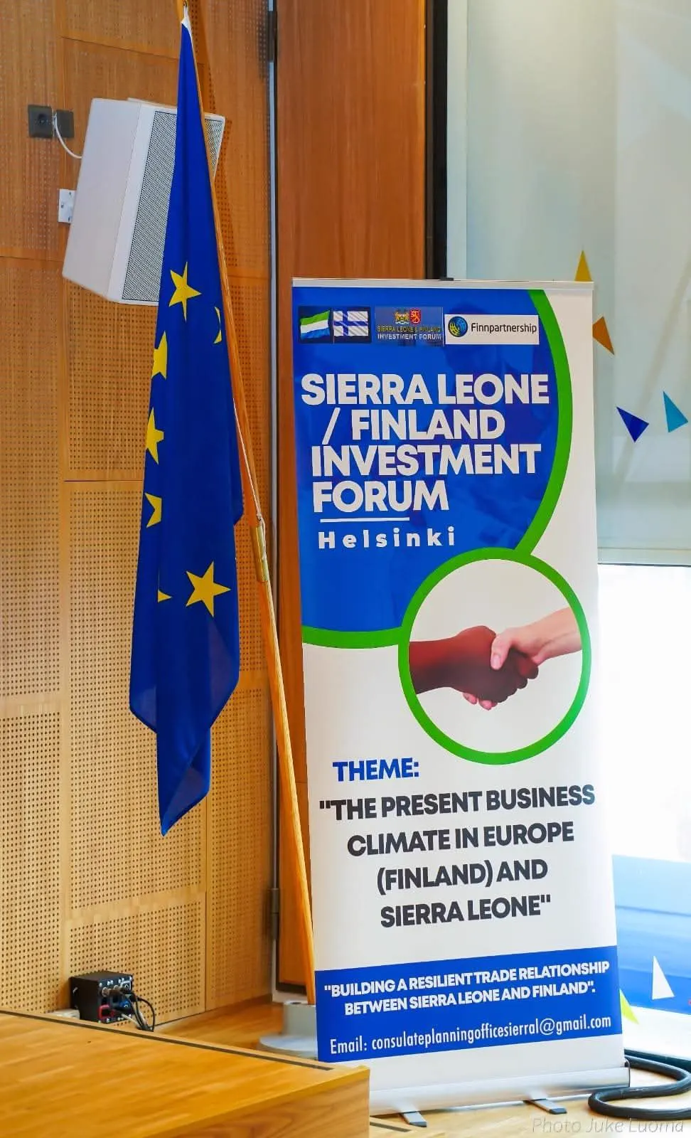 Sierra Leone-Finland Investment Forum banner beside the European Union flag in Helsinki