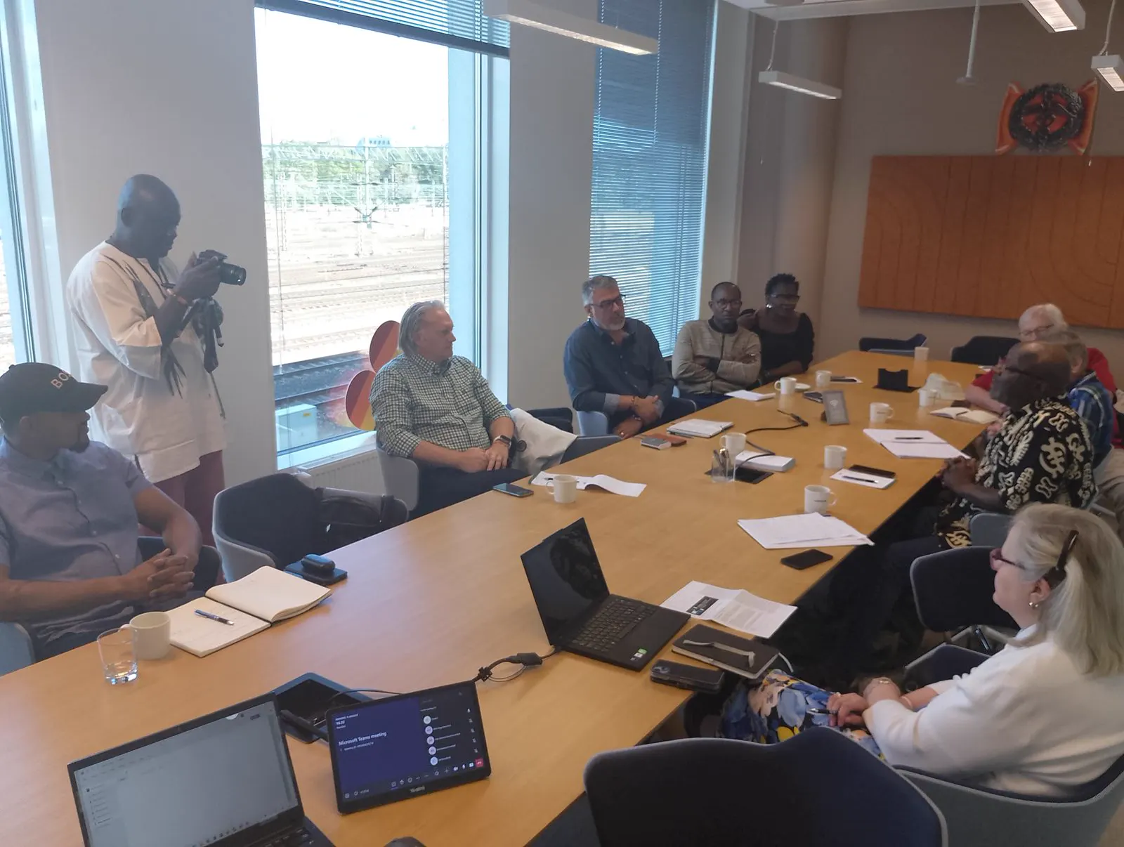 Participants gathered around a table during a Forum working session